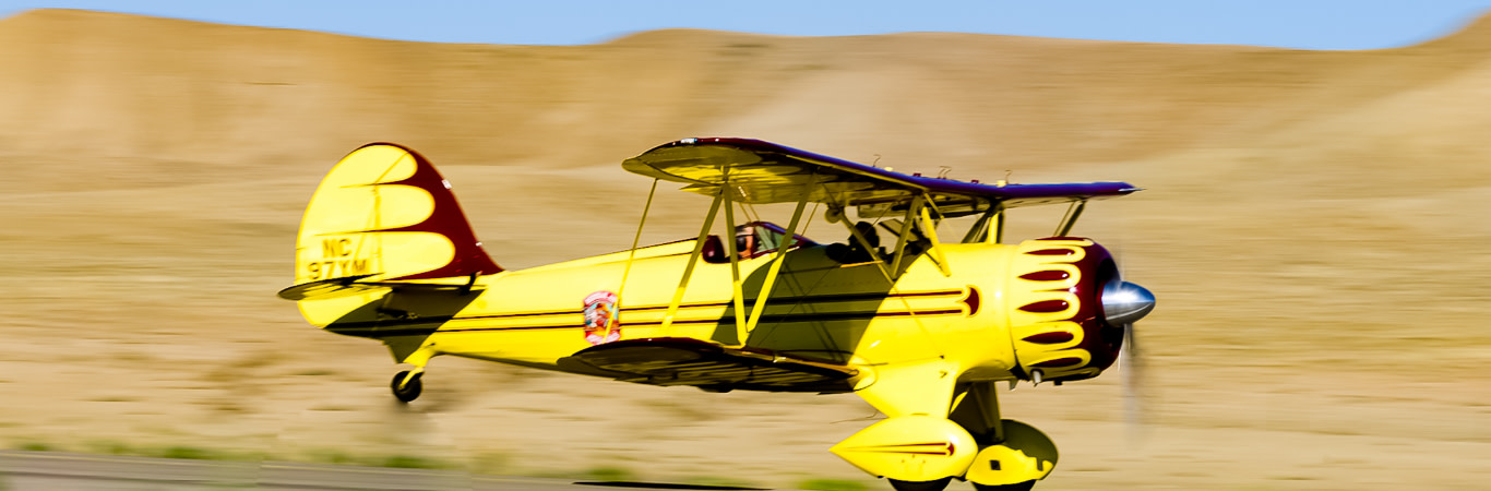 Yellow Waldo Pepper biplane tour flying over Moab