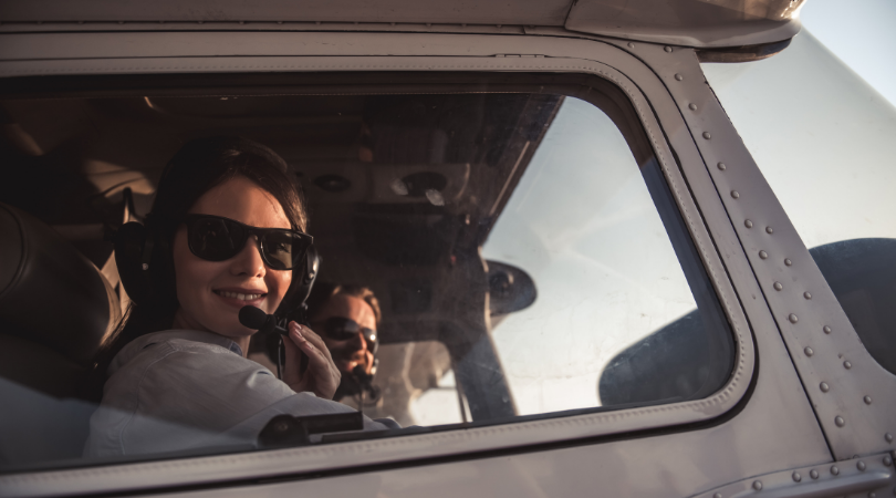 woman in airplane getting private pilot's license