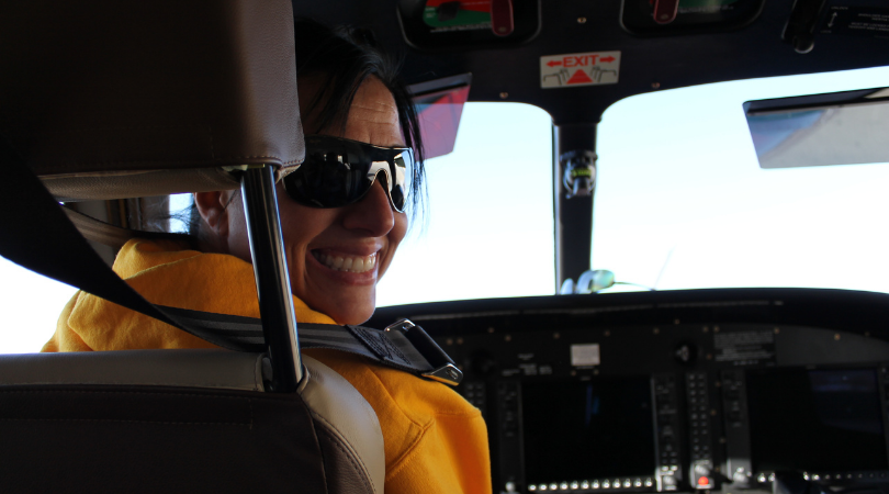 woman in pilots seat during flight instruction