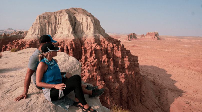 couple taking a break from hiking in Moab
