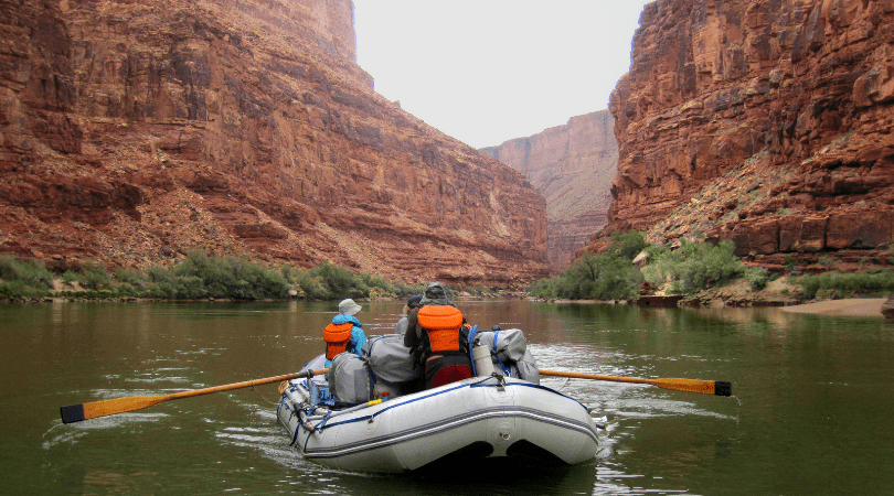 couple rafting the colorado river on romantic couples trip to Utah