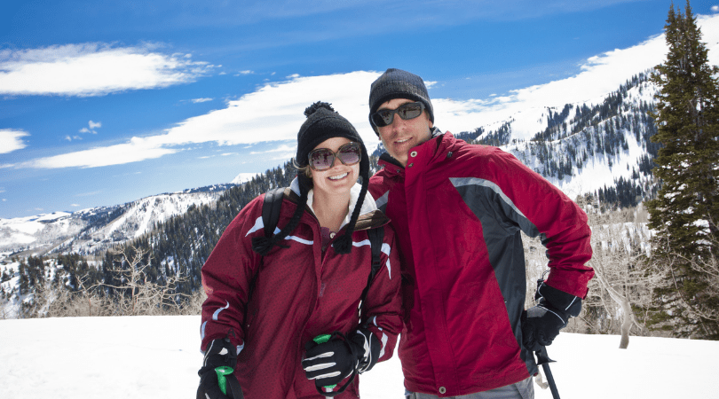 couple skiing during romantic winter getaway to Utah