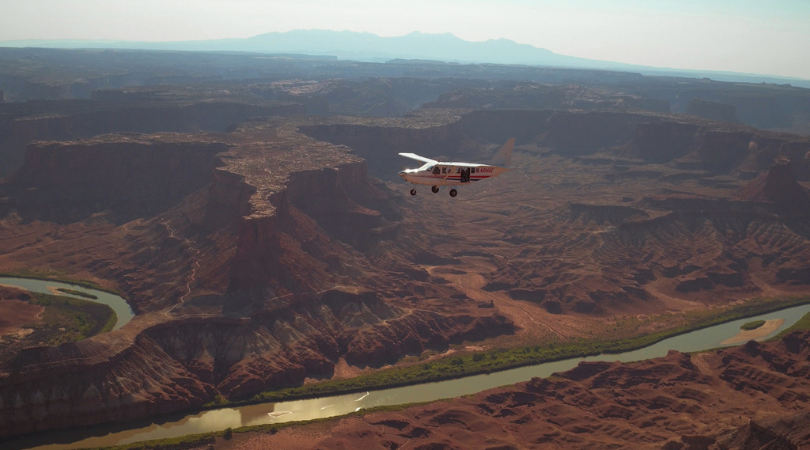 Redtail Air plane flying over Colorado River on scenic flight over Utah's Mighty 5