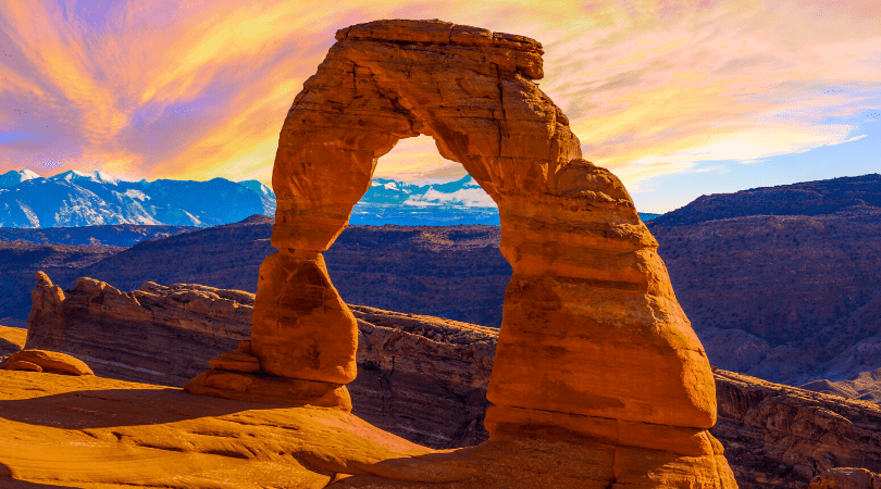 red rock arch at sunset