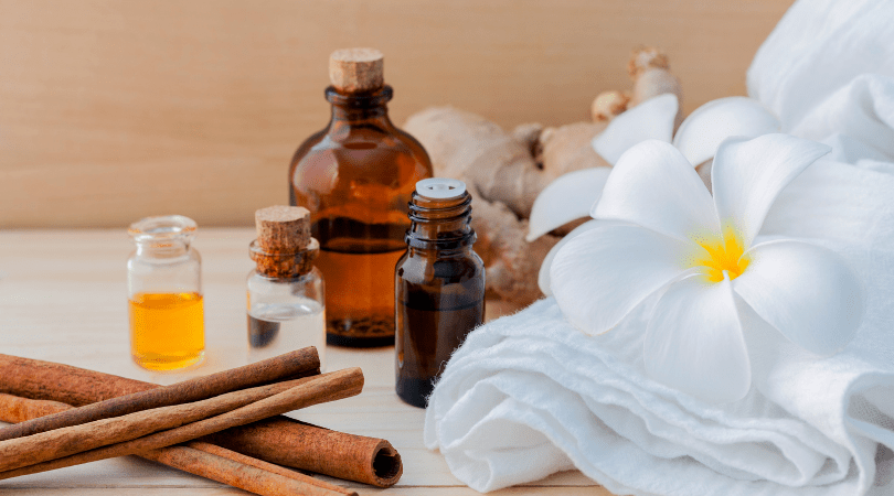 closeup of flowers and essential oils at spa