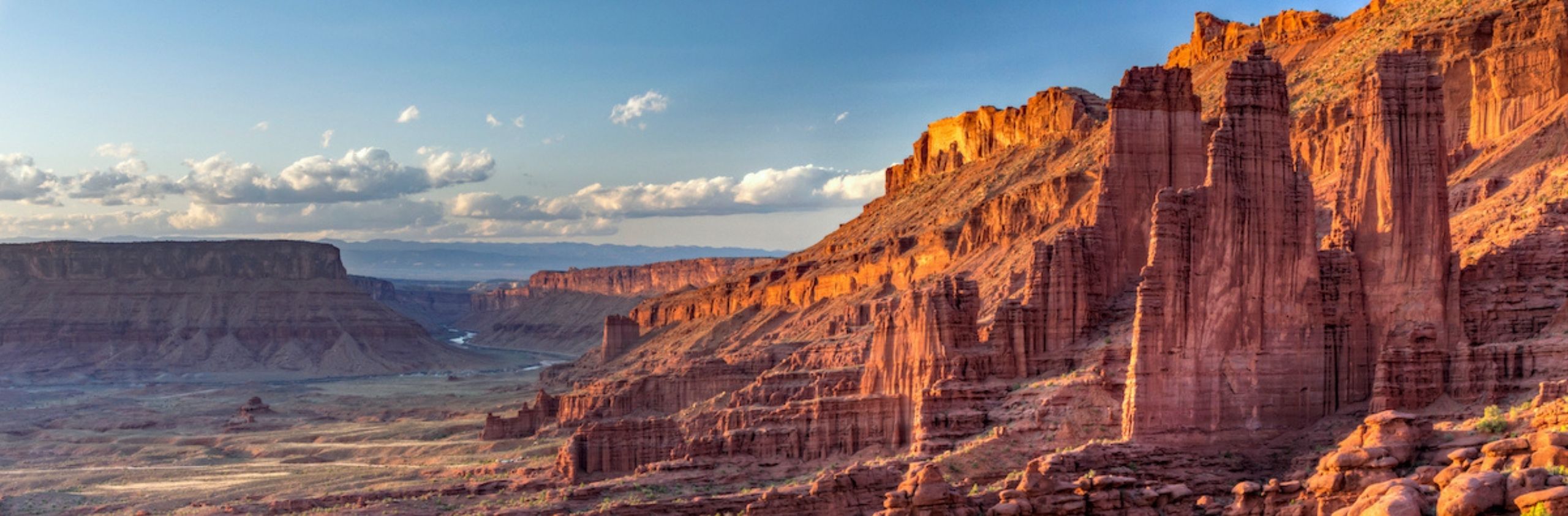 glowing light on vertical red cliffs and columns