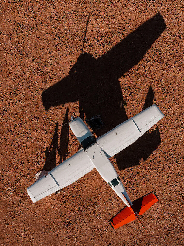 bird's eye view of airplane landed in the desert