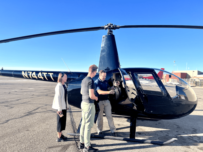 redtail air helicopter pilot and guests in front of a helicopter N744TT