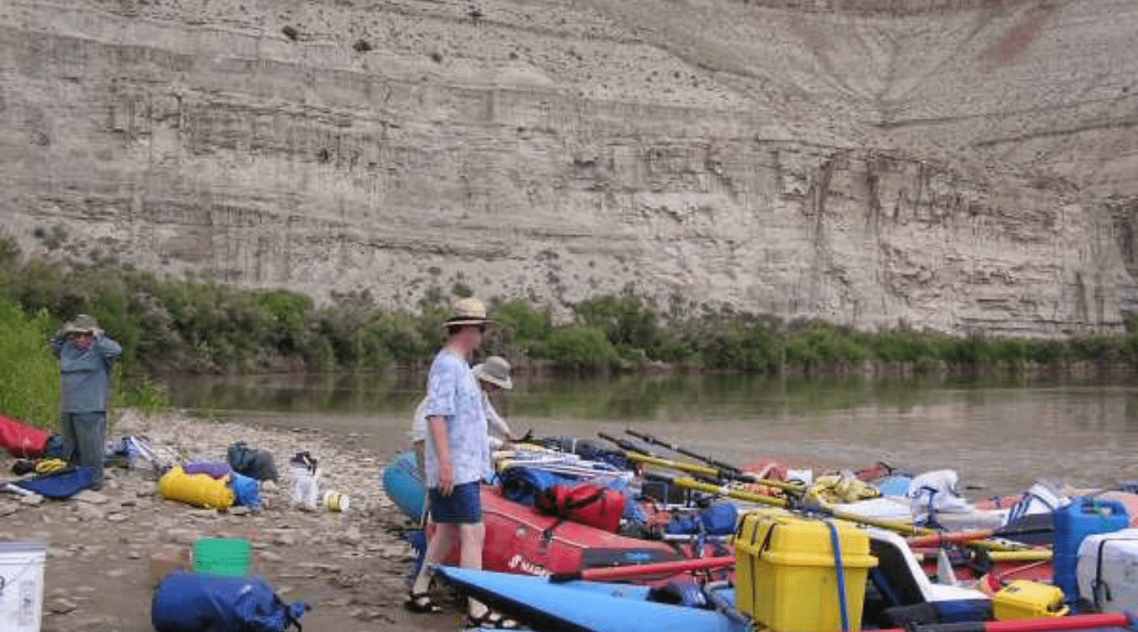 group of people loading gear onto their rafts while at Sand Wash river put in